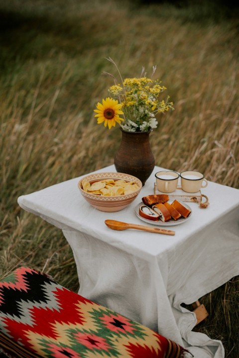 a table with food and flowers on it