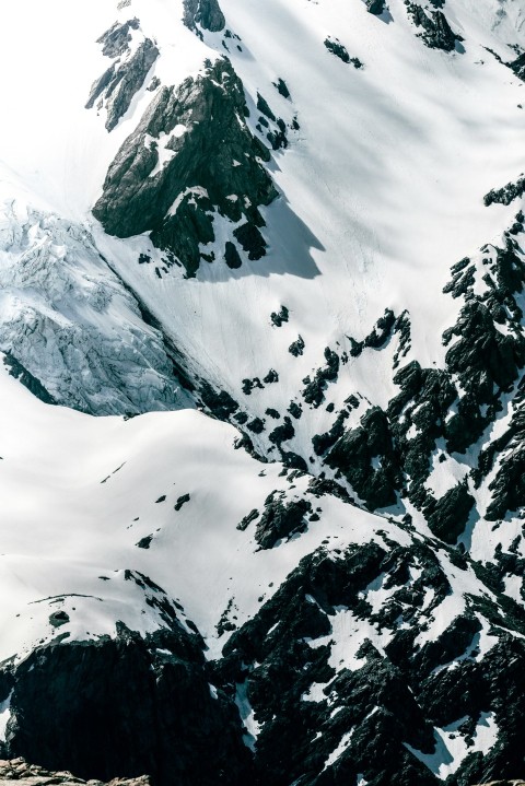 aerial photo of snow covered mountain at daytime