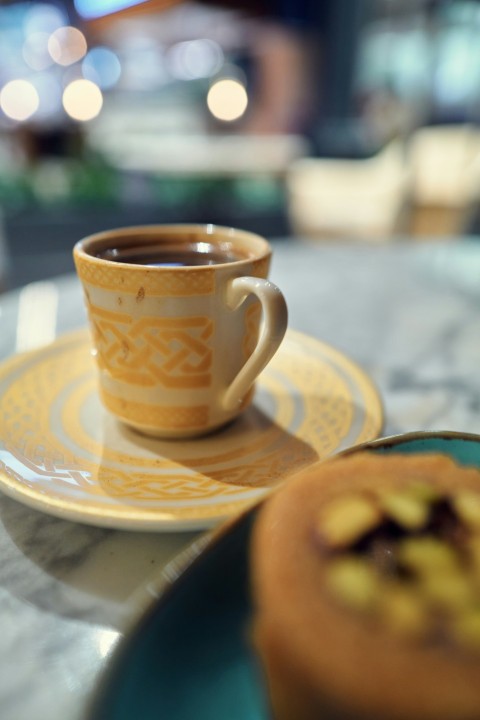 a cup of coffee on a saucer