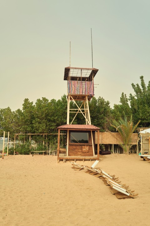 a structure outside with trees in the back