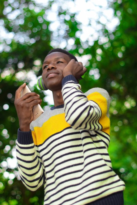 a woman holding a cell phone up to her ear