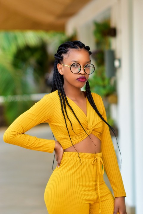 woman in yellow long sleeve shirt wearing black framed eyeglasses