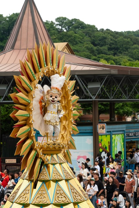 a parade float with a man on top of it