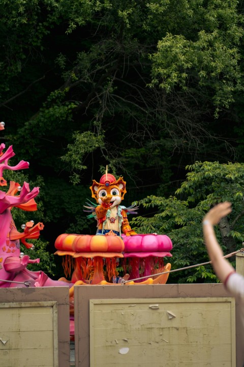 a group of people watching a parade float