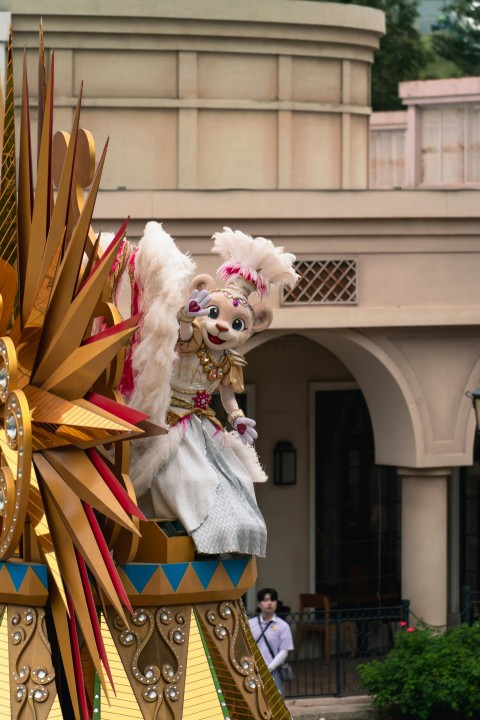 a parade float with a couple of people on top of it