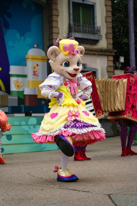 a group of people in costumes on a street