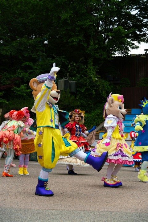 a group of people in costume dancing on a street