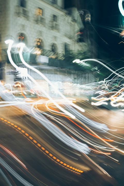 time lapse photography of vehicle on road at night JY