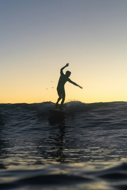 a person surfing on the waves