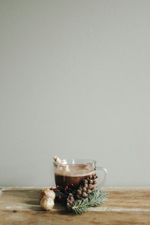 clear glass mug with brown liquid