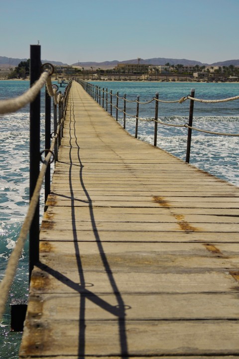 a long dock with a rope on the end of it