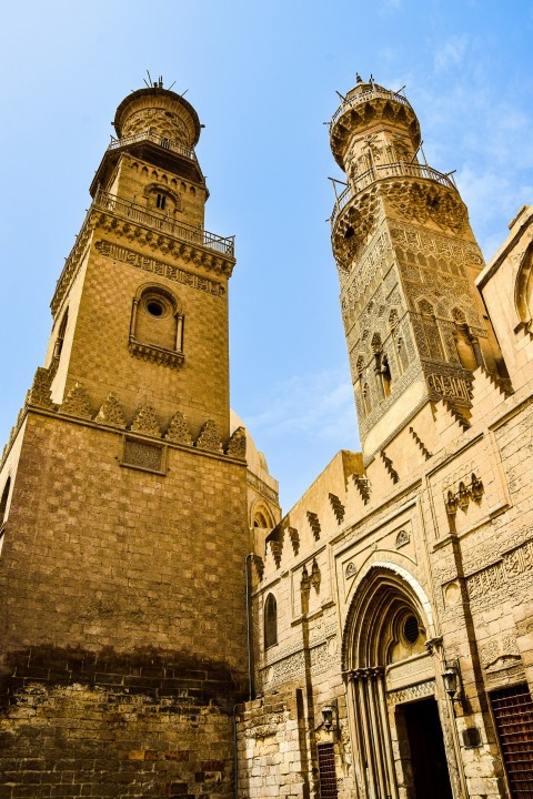 two tall towers with a clock on each of them