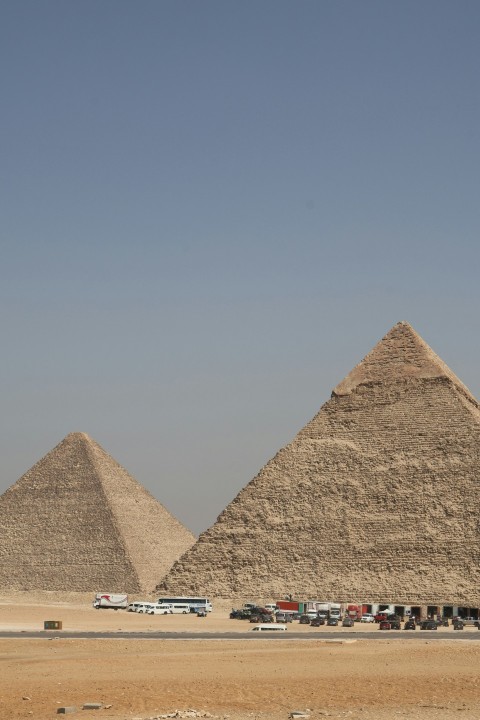 a bus driving past the pyramids of giza