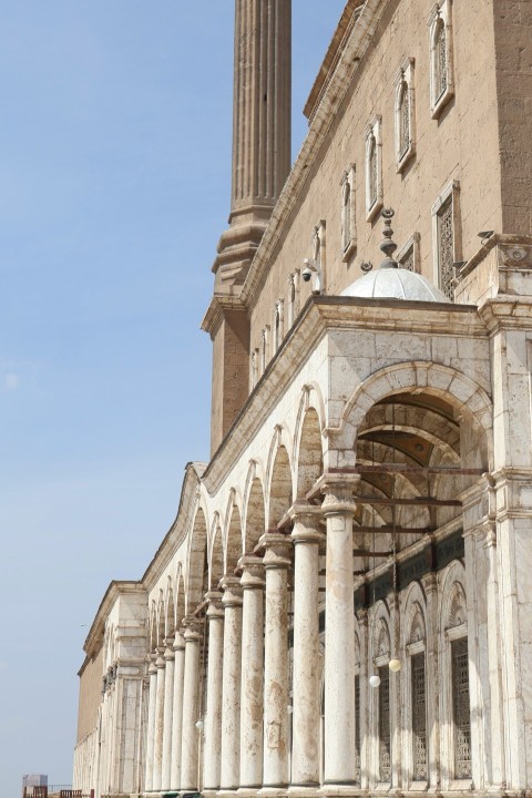 a large building with columns and a clock tower