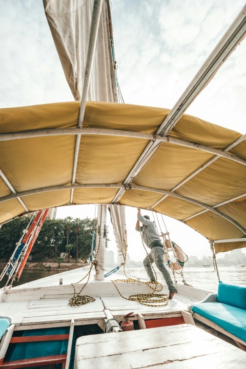 person on boat during daytime   anoWjsY