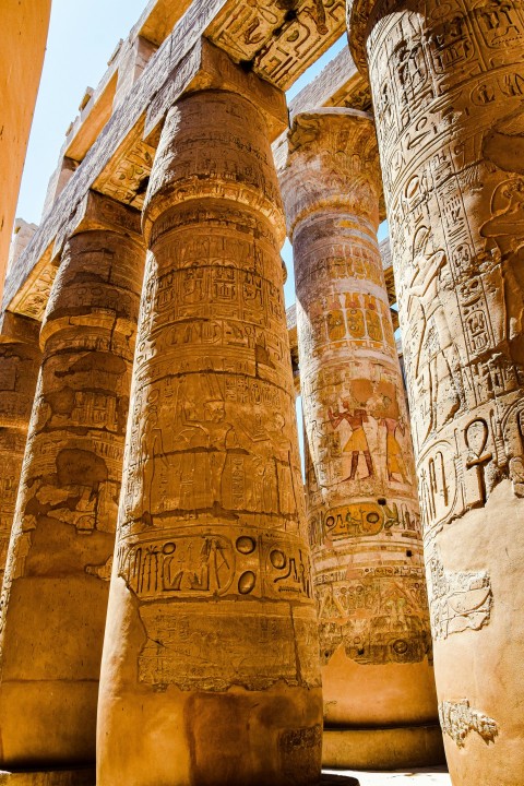 a number of large pillars with writing on them