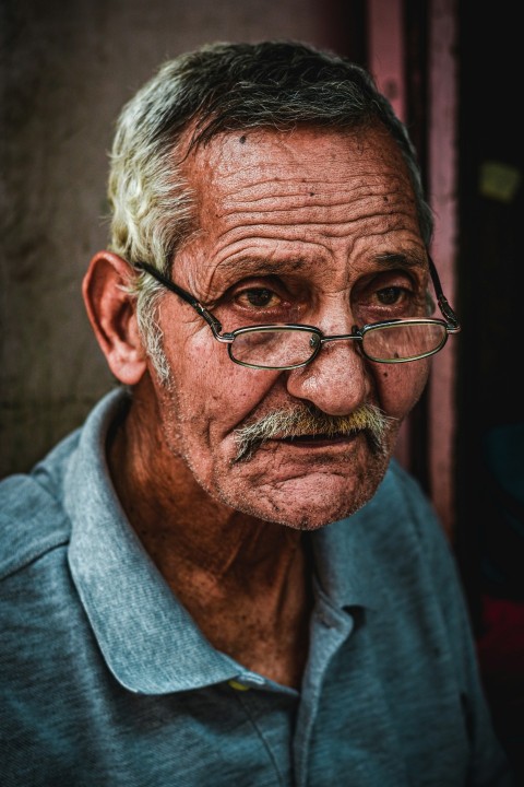 an old man with glasses and a mustache