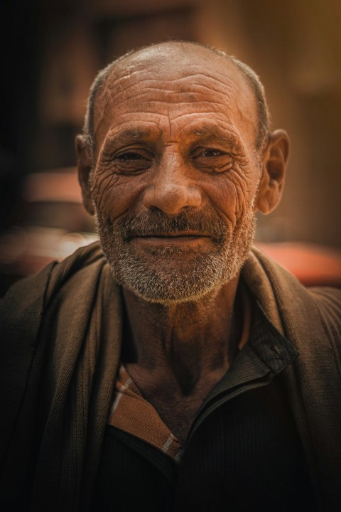 an old man with a beard and a black shirt