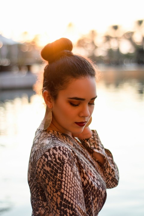 woman in brown and white shirt