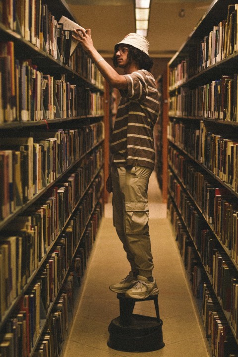 a man standing in a library