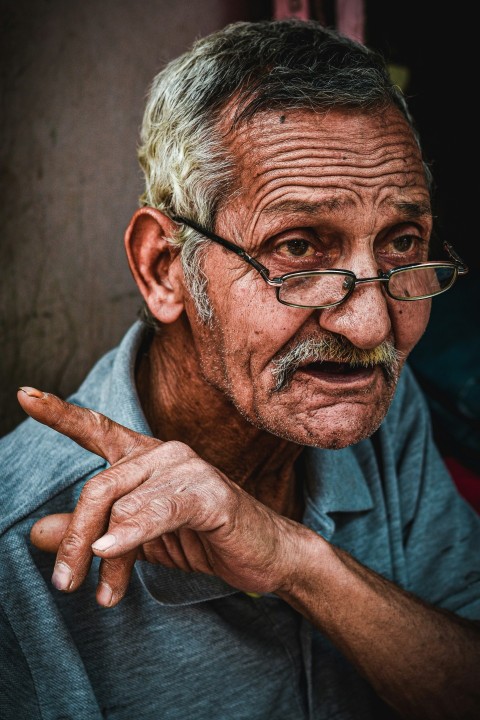 an old man with glasses and a mustache