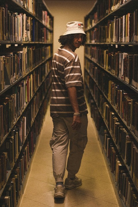 a man standing in a library