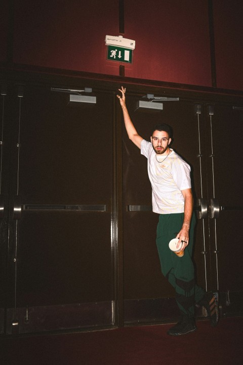 a man standing in front of a locker