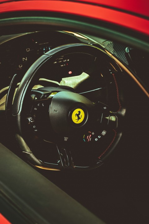 the interior of a car with a steering wheel BW