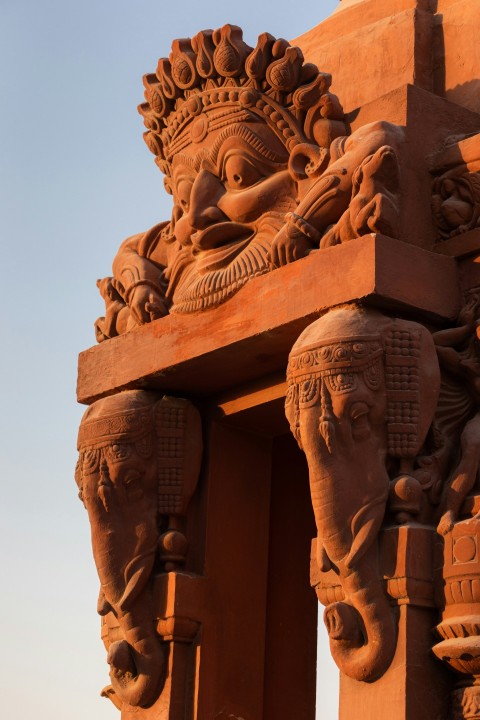 brown concrete statue during daytime