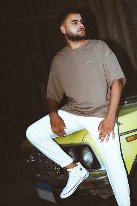 a man sitting on a surfboard