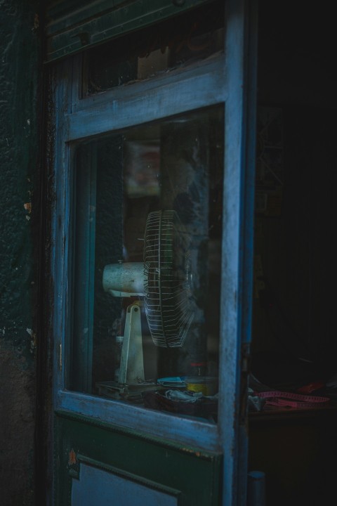 blue wooden framed glass window