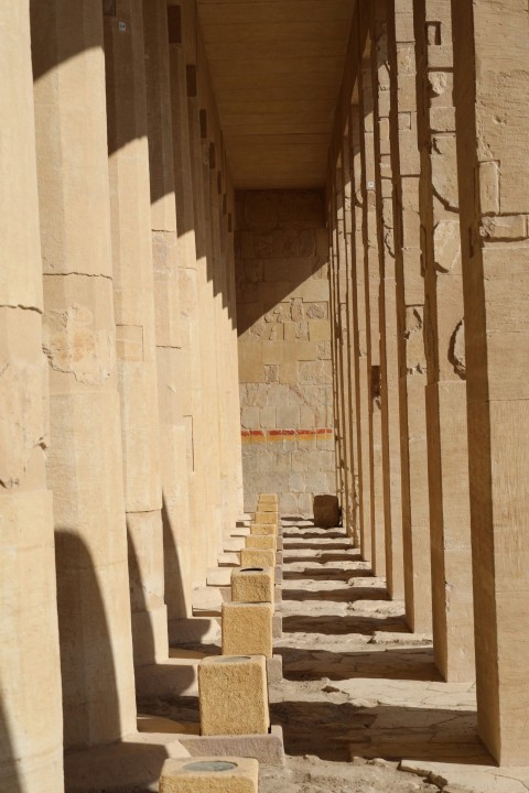 a row of stone pillars in a building xO0k