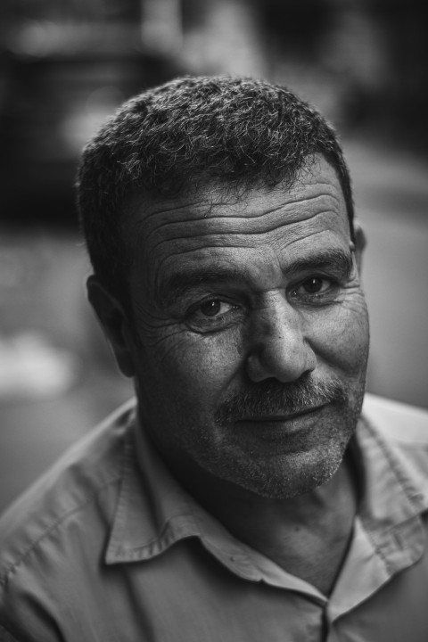 grayscale photo of man in button up shirt