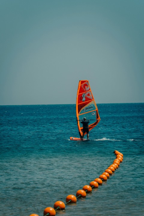 a man on a sailboard F6QnP7