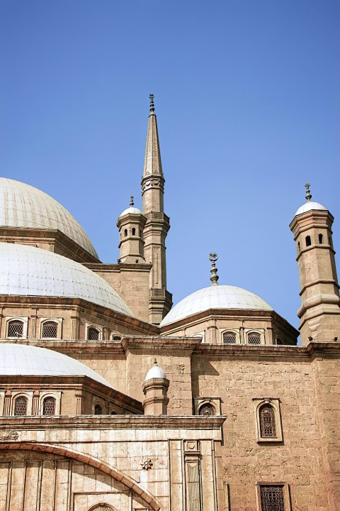 a large building with a clock on the front of it