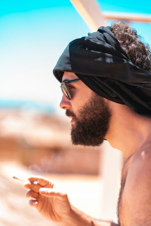 man in black knit cap and black framed eyeglasses