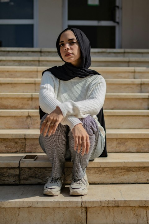 a person sitting on stairs