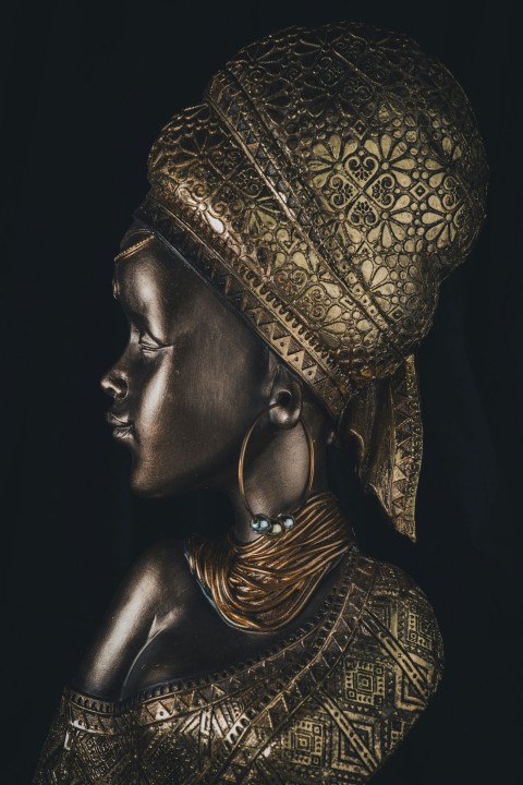 a statue of a woman wearing a gold headdress