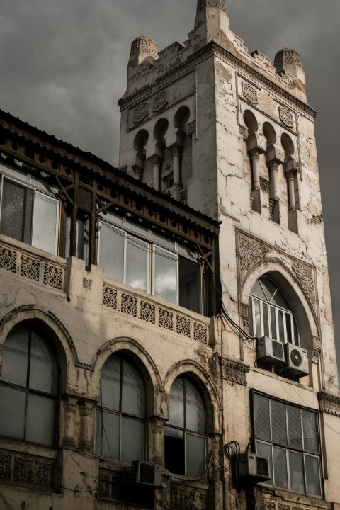 a tall building with a clock on the top of it