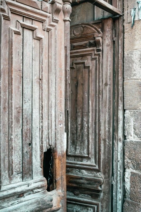 an old wooden door with carvings on it