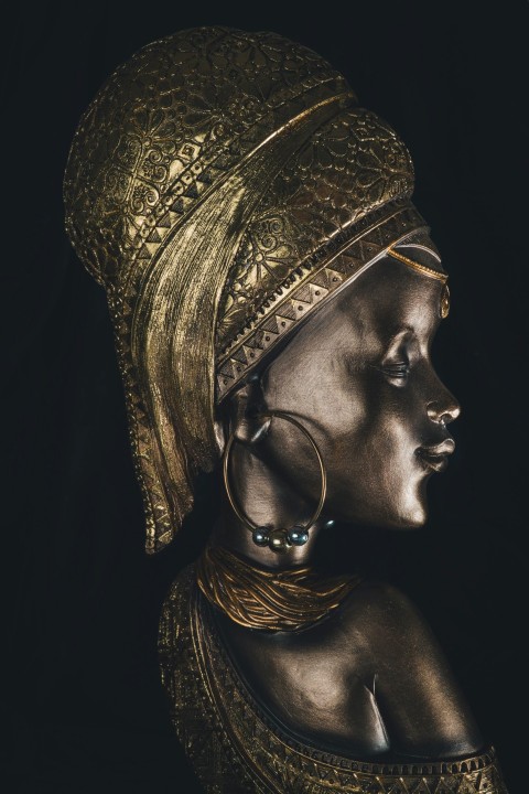 a statue of a woman wearing a gold headdress