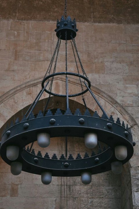 a chandelier hanging from the side of a building