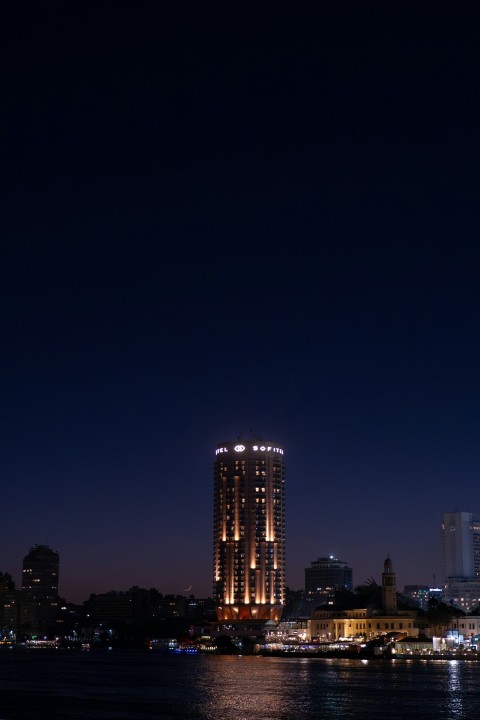 a night view of a city skyline and a body of water