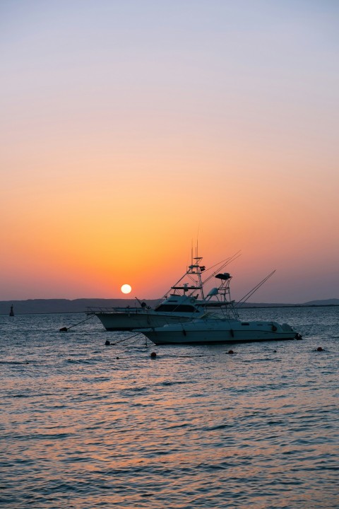 a boat floating on top of a body of water