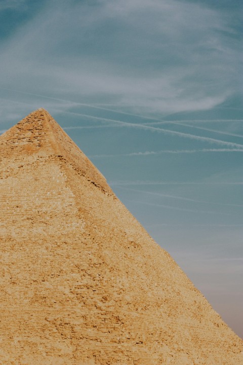 a very tall pyramid with a sky in the background