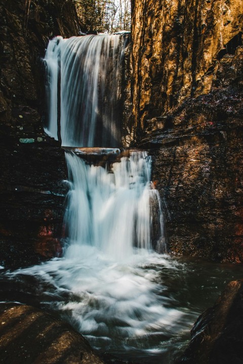 a waterfall with water flowing down its sides