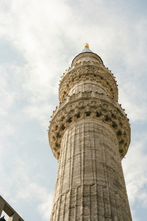 a tall tower with a clock on the top of it