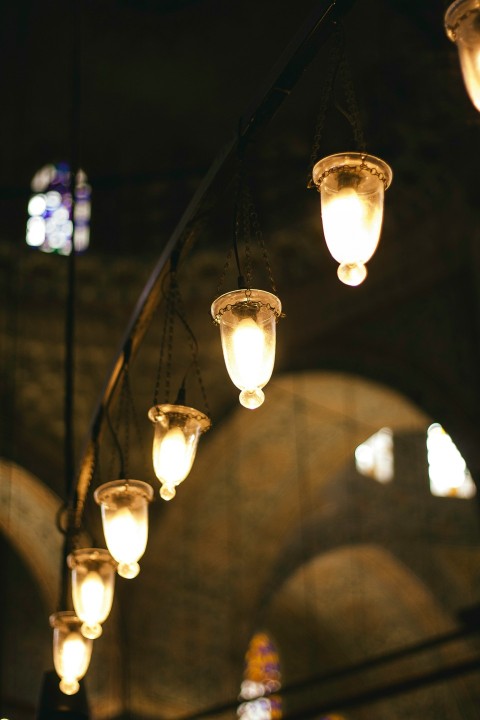 a bunch of lights that are hanging from a ceiling