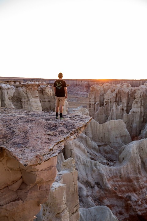 man standing on mountains edge