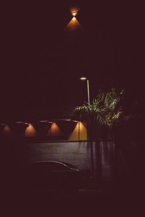 a street light is lit up in the dark